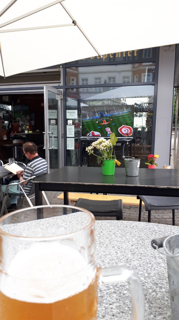 The first England game of the 2018 World Cup is on the tele in front of me. I am sitting outside at a small pub called Schlossplatzbrauerei, in Köpenick, Berlin