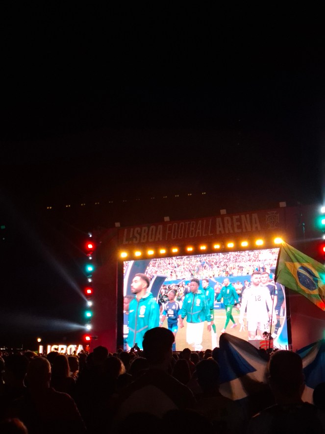 Brazil playing Scotland in the 2026 World Cup, on a giant screen in the Praça do Comércio fan park, Lisbon